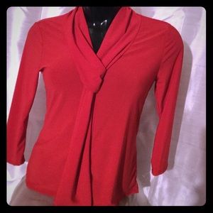 Soft material red blouse mid length sleeves.